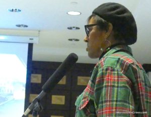 Resident Leslie Allen raises question about train station redevelopment, Dec. 13, 2018. Photo by Kevin Coughlin