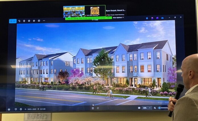 Architect Jim Dziegrenuk shows a rendering of the proposed townhomes at 300 Madison Ave.
